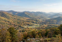 A scenic view of rolling Appalachian mountain ridges during autumn in the Roanoke Valley, Virginia.